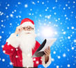 © Syda Productions - man in costume of santa claus with notepad