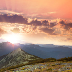 Wall Mural - beautiful mountains - sunset time. hight peaks, clouds and red