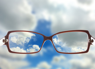 Canvas Print - Vision concept. Glasses on sky background