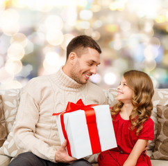 Poster - smiling father and daughter with gift box