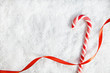 Candy Cane On Snowy Background