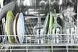 © Africa Studio - Open dishwasher with clean utensils in it
