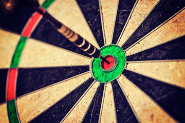 Dart in bull's eye close up