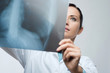 © stokkete - Female doctor examining x-ray image