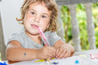 © Alena Yakusheva - young child girl writing in notebook, outdoors portrait, educati
