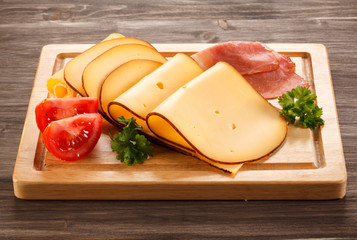 Wall Mural - Cheese on cutting board