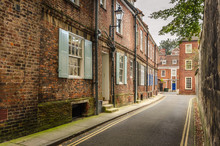 Narrow Street Lined With Renovated Brick Houses