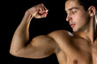 © Syda Productions - close up of young man showing biceps