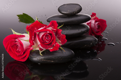 Naklejka dekoracyjna Spa stone and rose flowers still life. Healthcare concept.