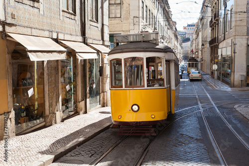 Fototapeta na wymiar Traditional Tram Moving On Street