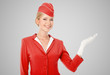 Charming Stewardess Dressed In Red Uniform Holding In Hand On Gr