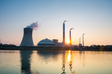 Poster - thermal power plant with the setting sun