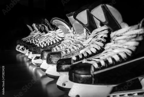 Photo Hockey skates lined up in locker room