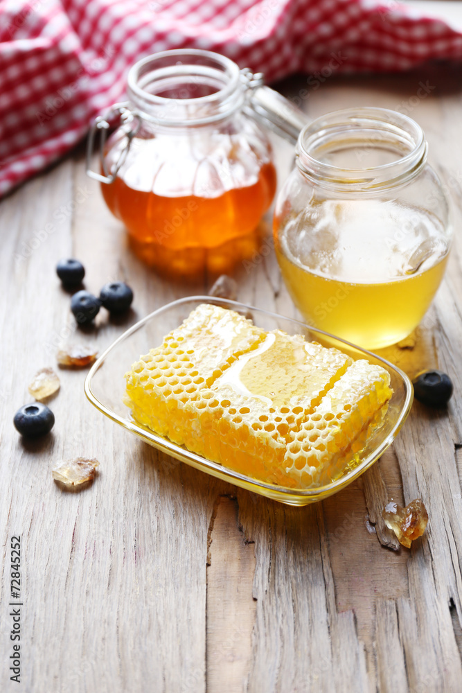 Fresh honey on wooden table