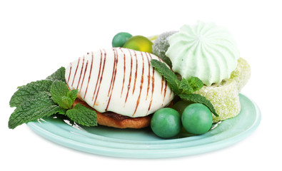 Wall Mural - Mint color meringues, mint jelly candies and tasty cake