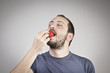 © gorkemdemir - Man eats strawberry