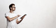© SFIO CRACHO - Young man working with digital tablet