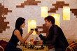 © mast3r - Young happy couple romantic date drink glass of red wine at