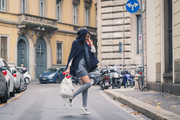 Beautiful girl posing in the city streets