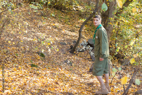 Fotografía Scout or ranger walking through woodland