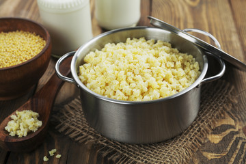 Wall Mural - Millet porridge  in a metal pan