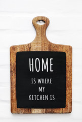 Wall Mural - Quote HOME IS WHERE MY KITCHEN IS on the cutting board. Rustic s