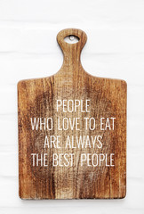 Wall Mural - Quote PEOPLE WHO LIKE TO EAT-BEST PEOPLE  on the cutting board.