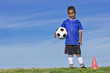 © Brocreative - Cute Young Soccer Player holding a ball