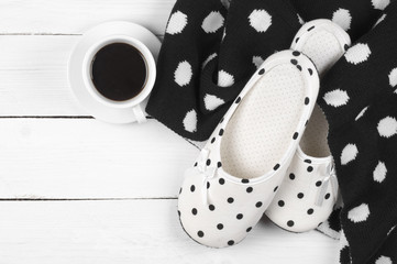 Feminine slippers, knitwear and coffee