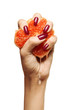 beauty female with purple nails squeezing grapefruit isolated