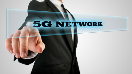 Wall Mural - finger pressing 5g network on transparent glass