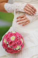 Wall Mural - Beautiful wedding bouquet in hands of bride