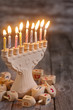 Jewish holiday hannukah symbols - menorah and wooden dreidels. C