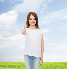 Canvas Print - smiling little girl in white blank t-shirt