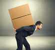 © ArtFamily - man carrying two heavy boxes