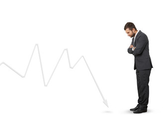 Canvas Print - man looking at downturn graph