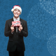 Poster - businessman in santa hat holding gift