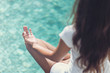 © XtravaganT - Slim Woman Meditating at the Poolside
