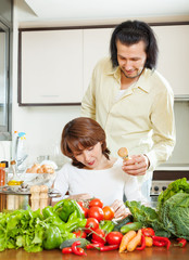 Wall Mural - woman and handsome husband cooking together