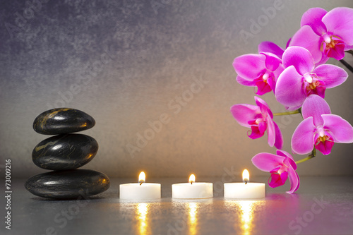Japanese ZEN garden with stones, candle lights and orchid flower Plakat