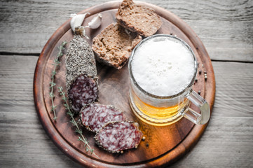 Poster - Slices of french Saucisson sausage with glass of beer