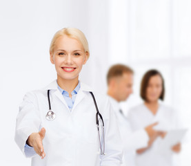 Poster - smiling female doctor with stethoscope