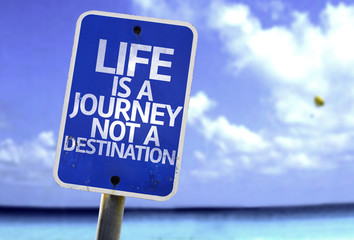 Life is a Journey not a Destination sign with a beach