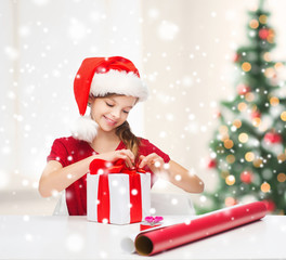 Sticker - smiling girl in santa helper hat with gift box