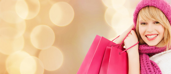 smiling young woman with shopping bags