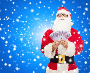 Canvas Print - man in costume of santa claus with euro money