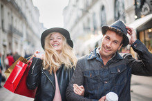 A Trendy Young Couple  Wearing Hats Walking In The City In Autum