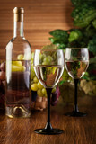 Fototapeta Lawenda - Bottle and glasses of white wine
