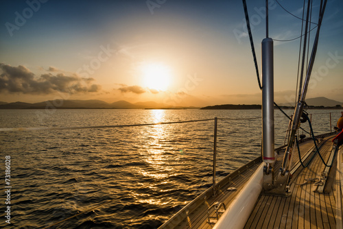 Naklejka ścienna sunset on the sea from the sail boat