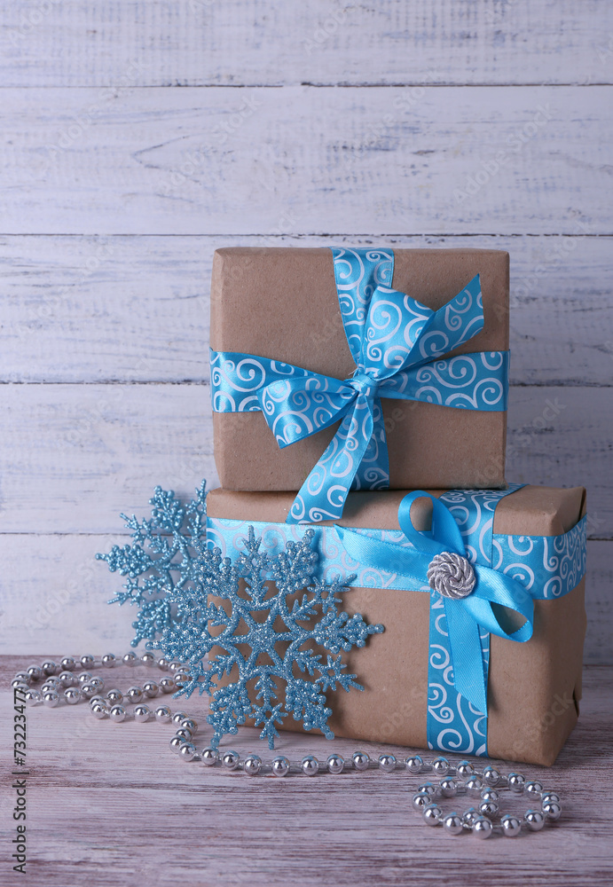 Holiday gift boxes decorated with blue ribbon